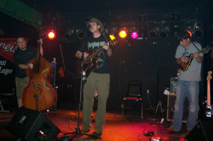 HTH performing live with stage lights